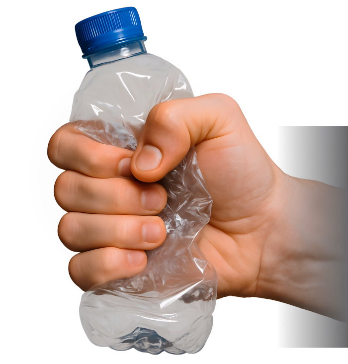Hand crushing a plastic water bottle against a grey background.